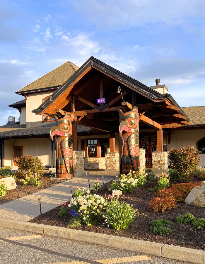 The entrance to a building with beautifully carved totem pillars